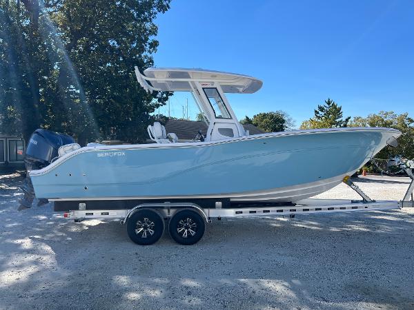 Sea Fox 268 Commander 2025 Sea Fox 268 Commander boat on trailer, parked outdoors under clear blue sky.