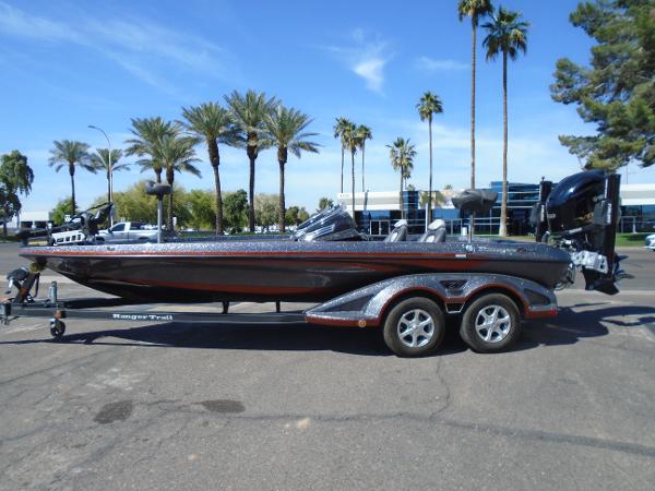 Ranger Z521 Comanche 2015 Ranger Z521 Comanche boat on trailer, parked under palm trees.