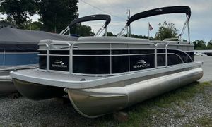 Bennington SV 22 Quad Bench 2024 Bennington SV 22 Quad Bench pontoon boat on display outdoors.