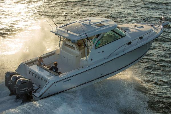 Pursuit OS 385 Offshore Manufacturer Provided Image: 2015 Pursuit OS 385 Offshore boat cruising on water.