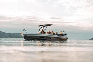 Highfield ADV7 - 25% Share NEW ADV 7 2026 Highfield ADV7 boat cruising on calm waters at sunset.