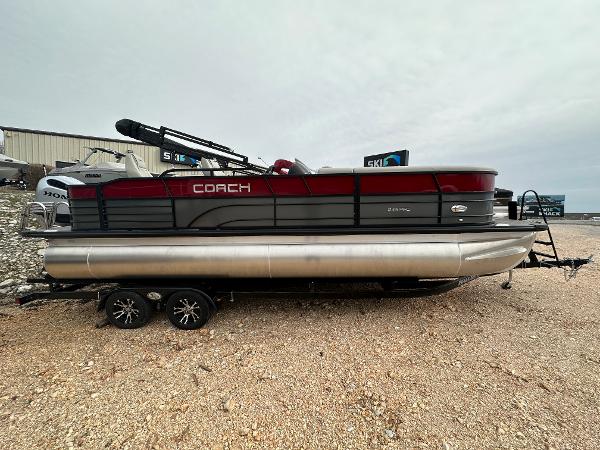 Coach Pontoons 243PFC 2023 Coach Pontoons 243PFC pontoon boat on a trailer.