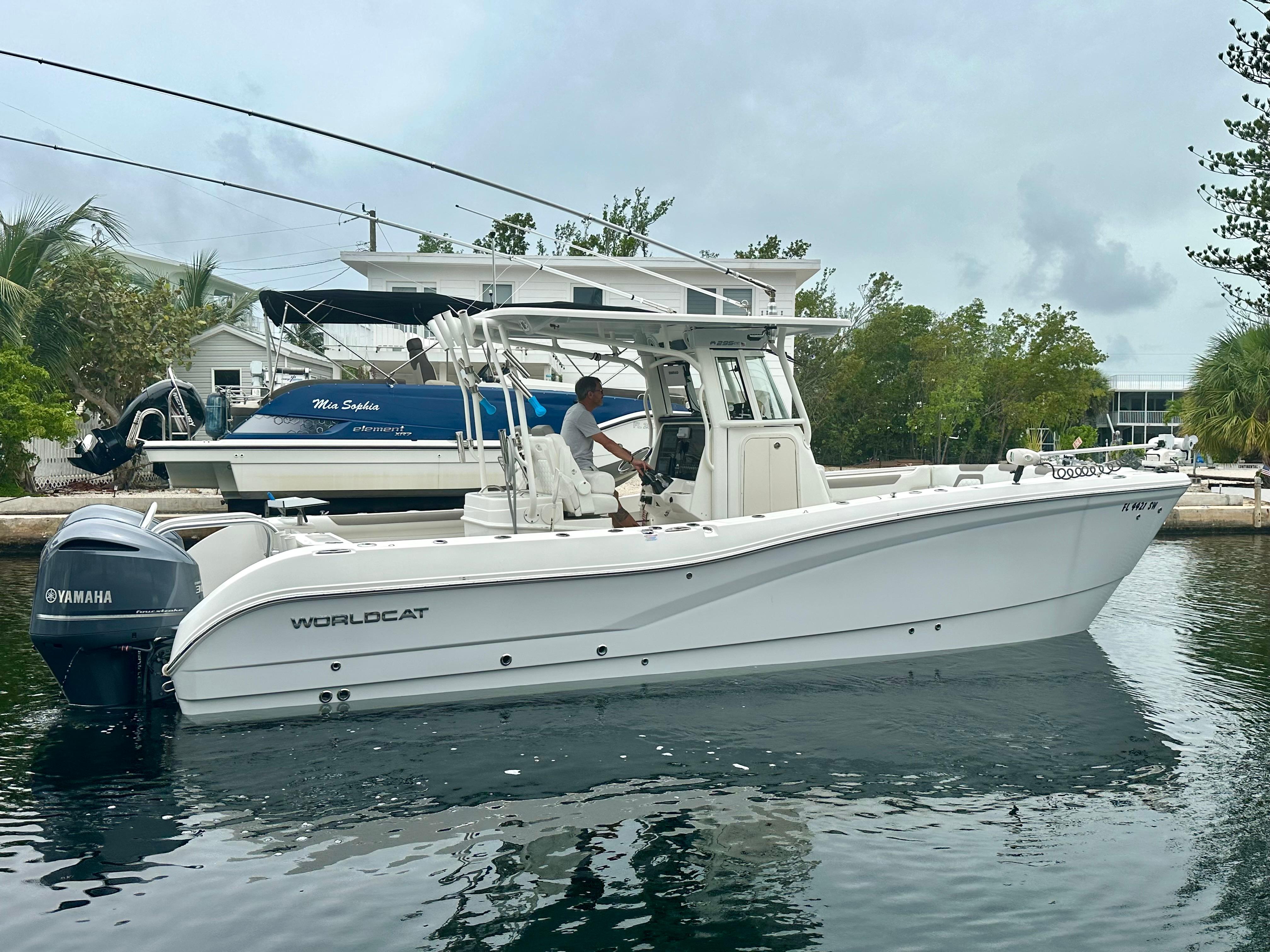 World Cat 295 CC 2021 World Cat 295 CC boat with Yamaha engines on calm water.