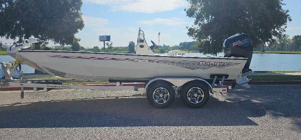 Ranger RB200 2024 Ranger RB200 boat on trailer by a lake, sunny day.