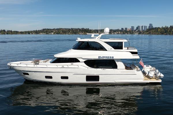 Ocean Alexander 70E Motoryacht 2018 Ocean Alexander 70E Motoryacht on calm water, city skyline in background.