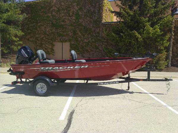 Tracker Super Guide V-16 T 2025 Tracker Super Guide V-16 T boat on trailer in parking lot.