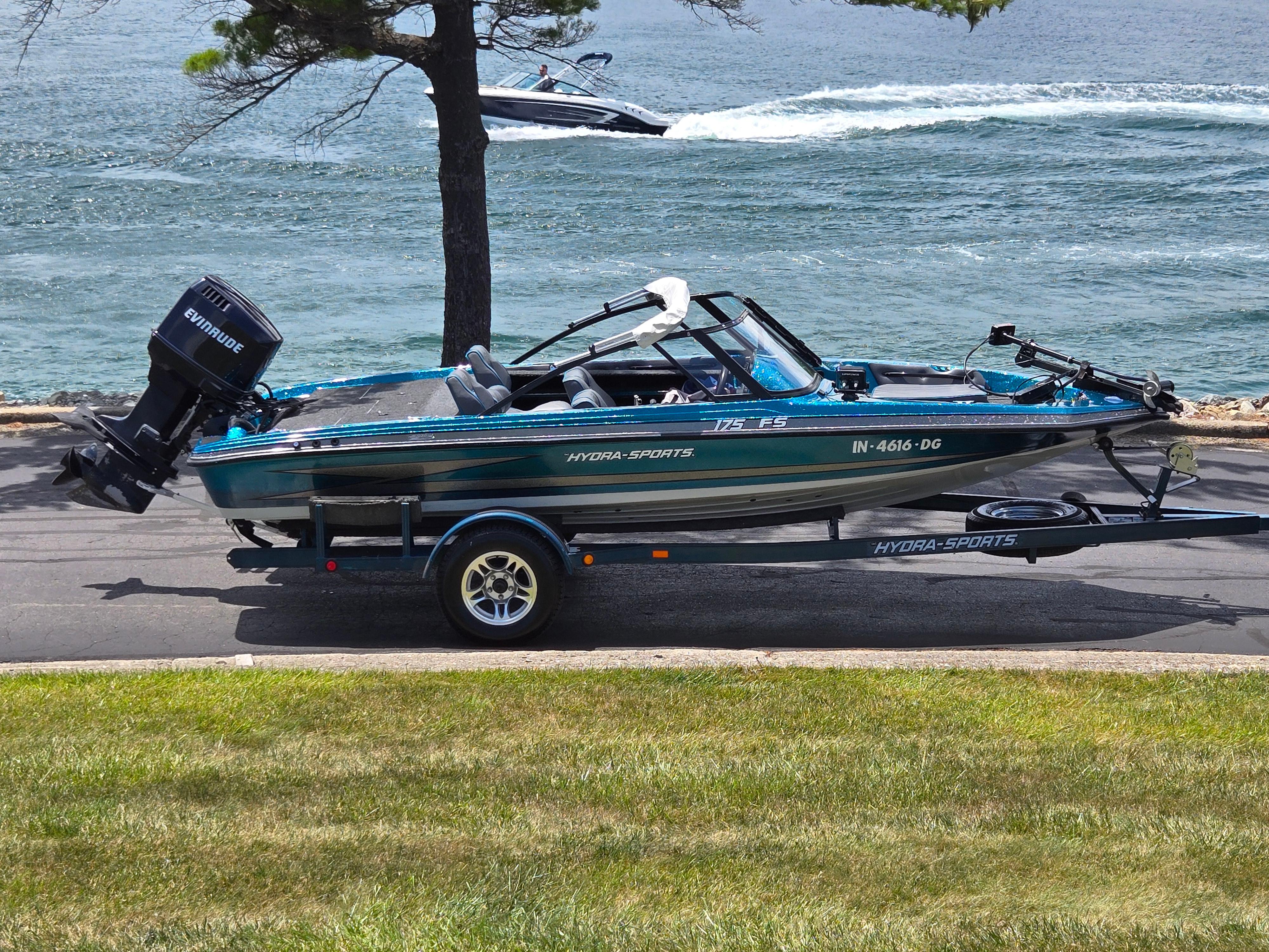 Hydra-Sports 175 FS 1994 Hydra-Sports 175 FS boat on trailer by a lake, with Evinrude motor.