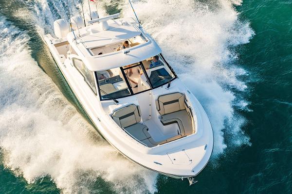 Pursuit DC 365 Dual Console Manufacturer Provided Image: 2025 Pursuit DC 365 Dual Console boat cruising on open water.