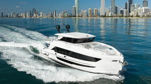 Horizon FD90 Luxury Horizon FD90 yacht cruising near a city skyline, 2023 model.