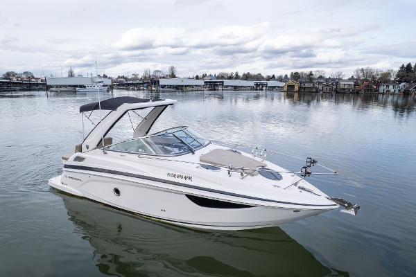 Regal 28 Express 2015 Regal 28 Express boat on calm water with overcast sky.