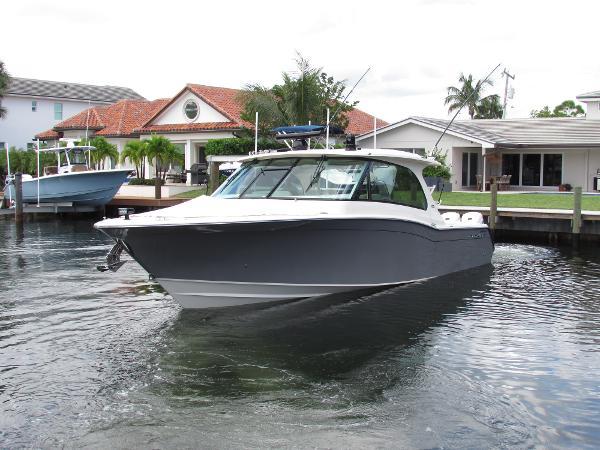 Grady-White Freedom 415 2024 Grady-White Freedom 415 boat docked near waterfront homes.