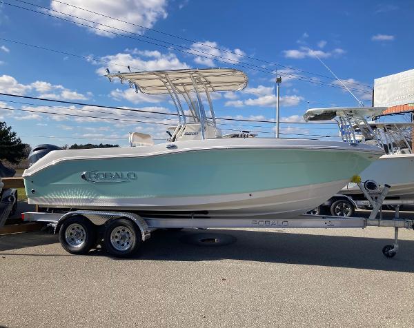 Robalo R200 Center Console 2024 Robalo R200 Center Console boat on a trailer under a clear blue sky.