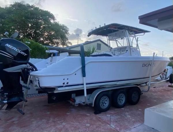 Donzi 32 ZF Open 2012 Donzi 32 ZF Open boat on a trailer with Mercury outboard engines.