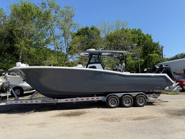Tidewater 320 CC Adventure 2025 Tidewater 320 CC Adventure boat on a trailer, parked outdoors.