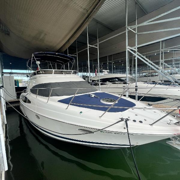 Regal Commodore 3880 2002 Regal Commodore 3880 yacht docked in a marina.