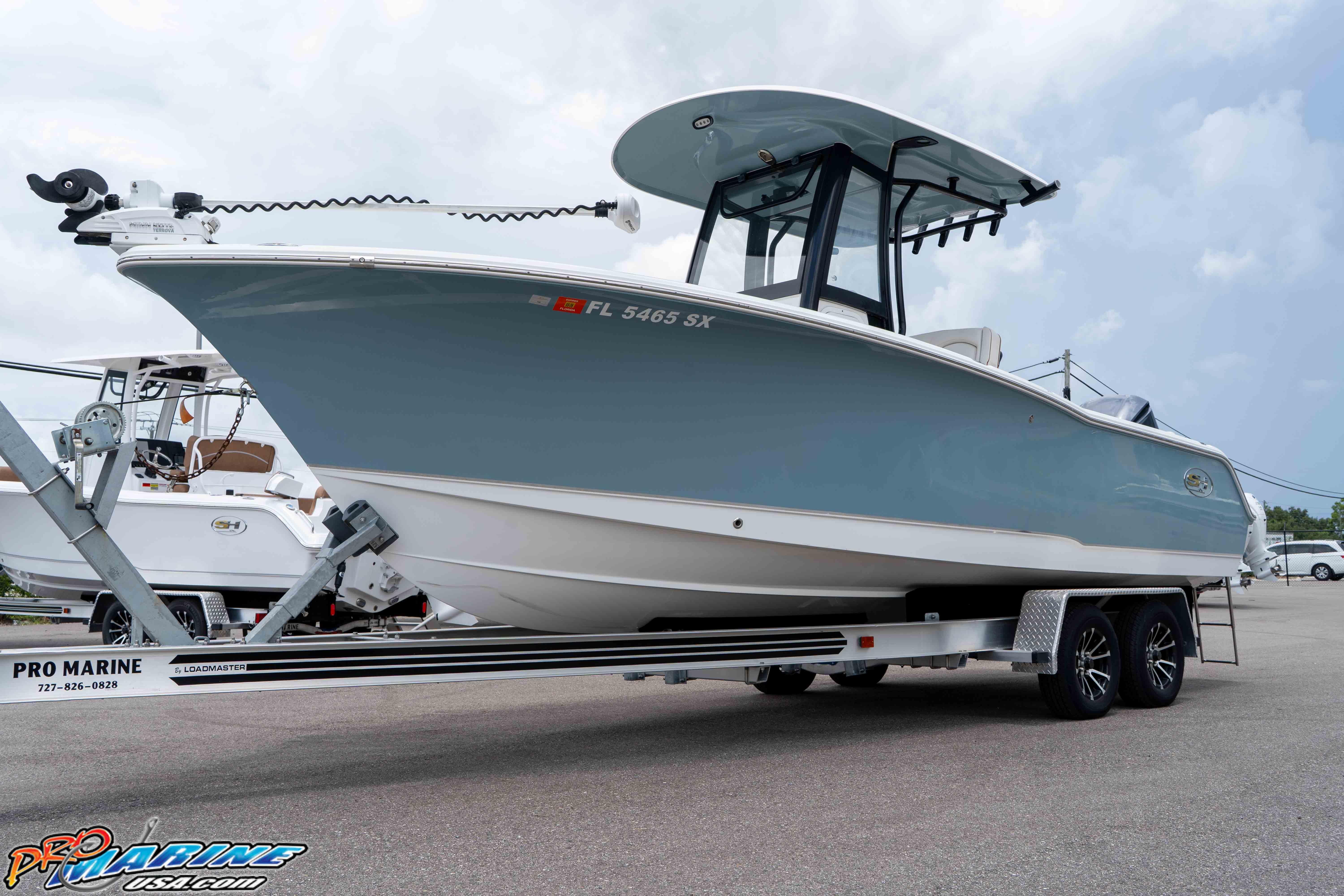 Sea Hunt Ultra 239 SE 2021 Sea Hunt Ultra 239 SE boat on trailer, displayed outdoors.