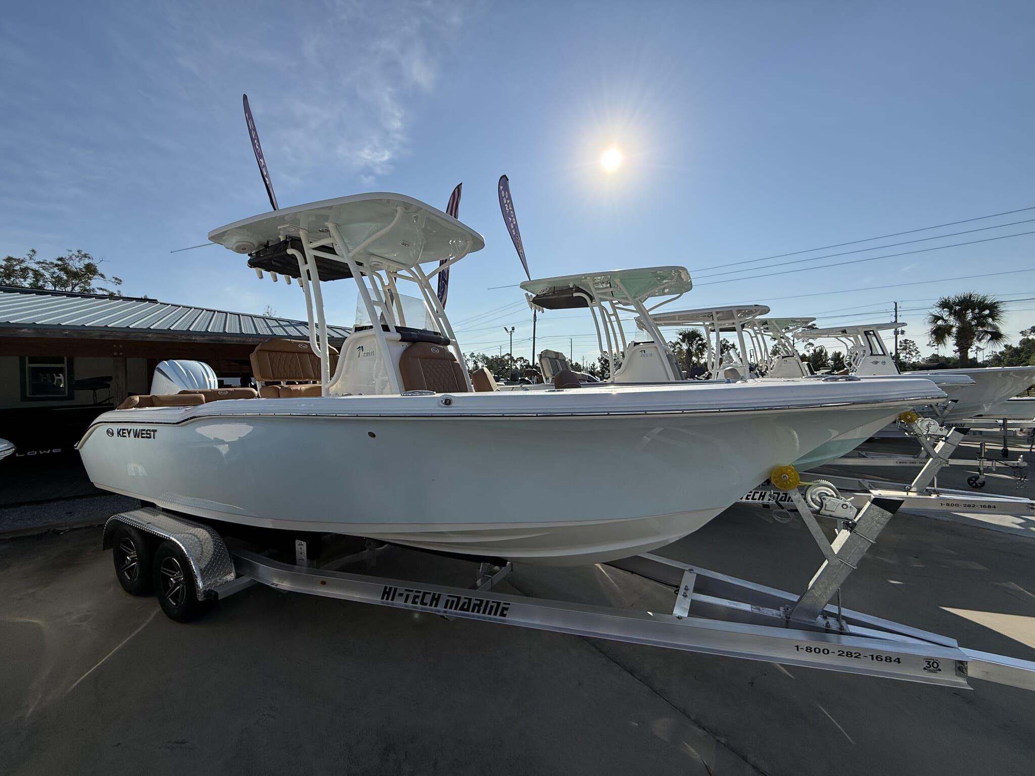 Key West 239 FS 2025 Key West 239 FS boat on trailer under clear sky.