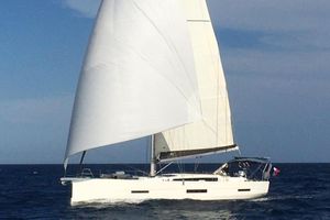 Dufour 56 Exclusive 2019 Dufour 56 Exclusive sailing yacht on open sea with full sails.