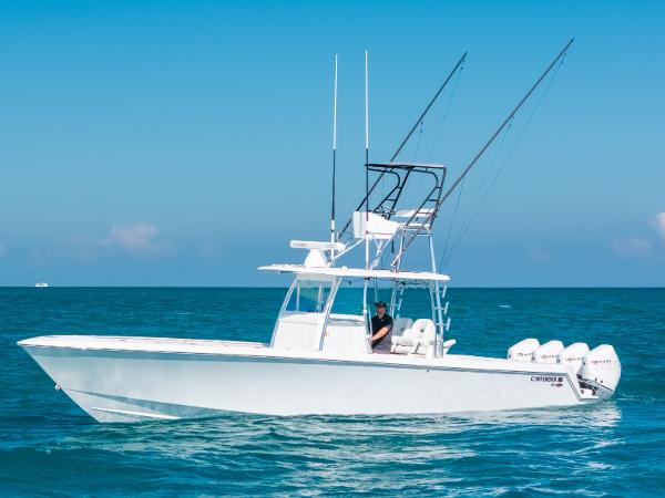 Contender 39 ST 2023 Contender 39 ST boat on open sea with clear blue sky.