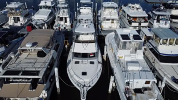Tiara Yachts FLY BRIDGE Aerial view of a 1991 Tiara Yachts Fly Bridge docked among other boats.