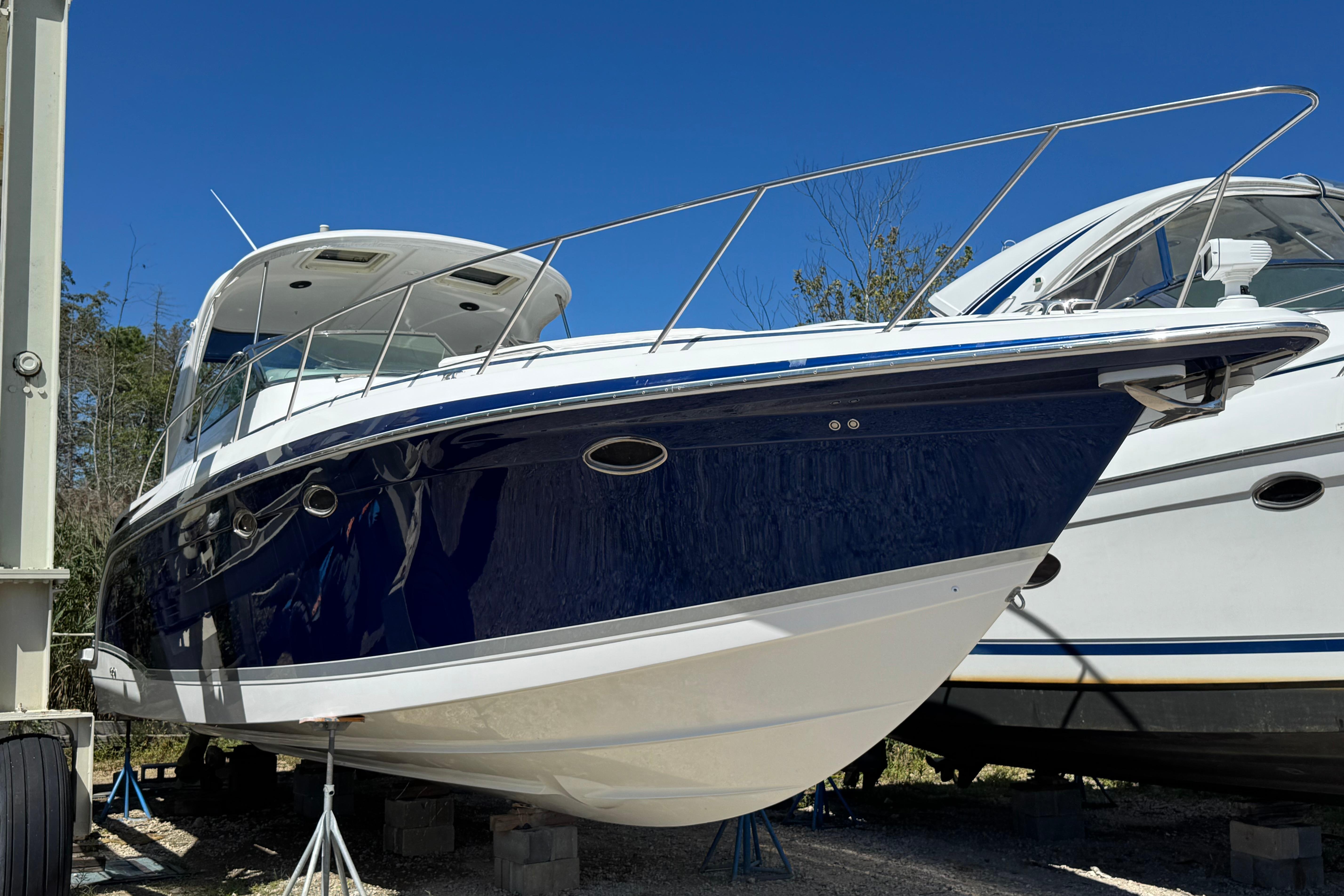 Formula 40 Performance Cruiser 2006 Formula 40 Performance Cruiser boat on dry dock, blue and white exterior.
