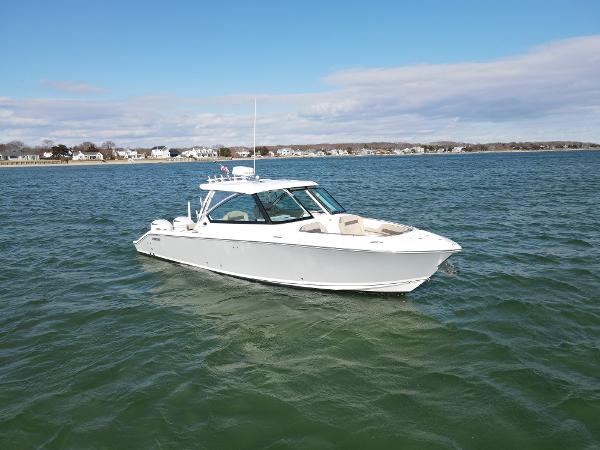 Pursuit DC 325 Dual Console 2019 Pursuit DC 325 Dual Console boat on open water, clear sky background.