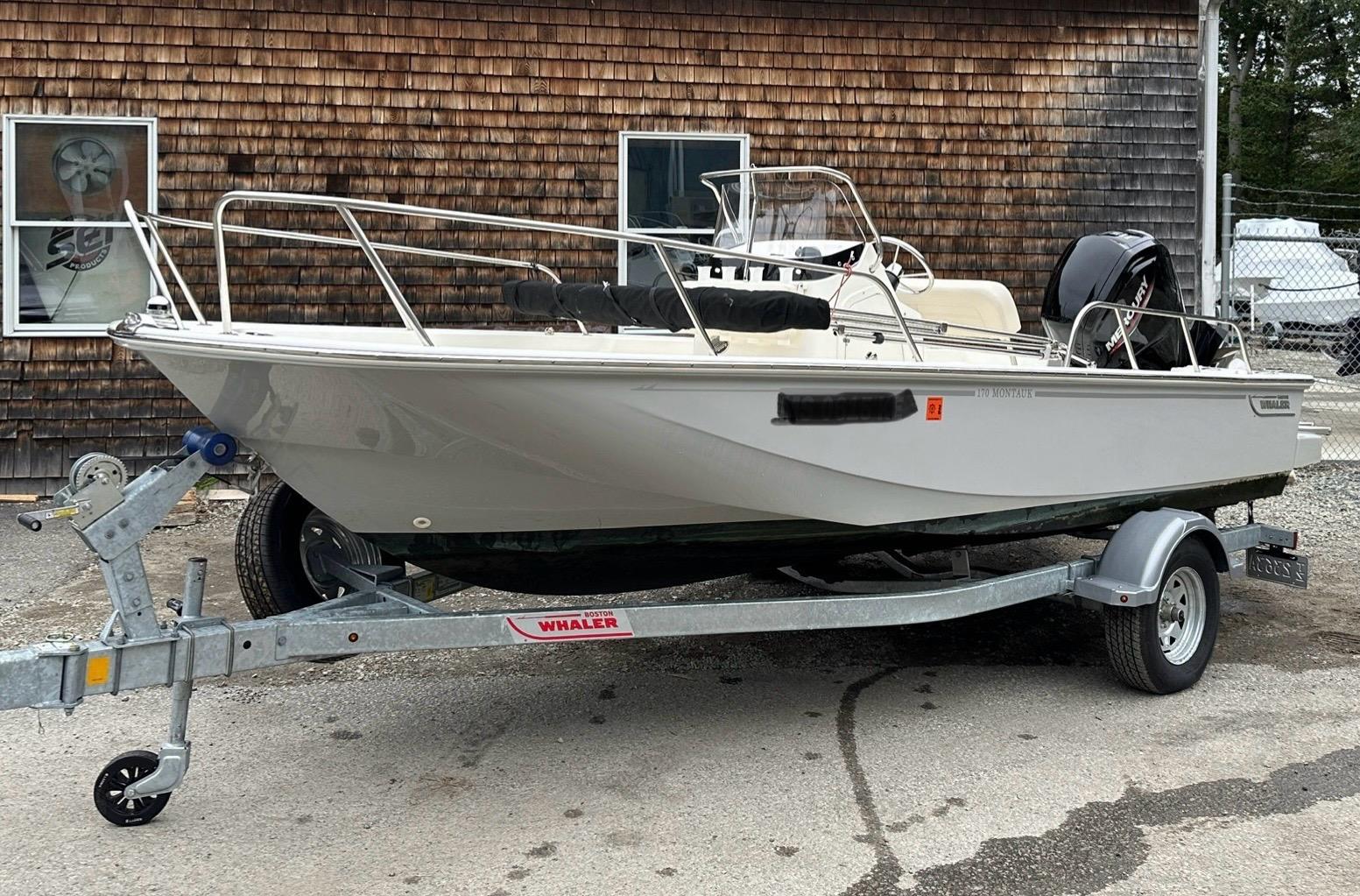 Boston Whaler 170 Montauk 2024 Boston Whaler 170 Montauk boat on trailer, parked outdoors.
