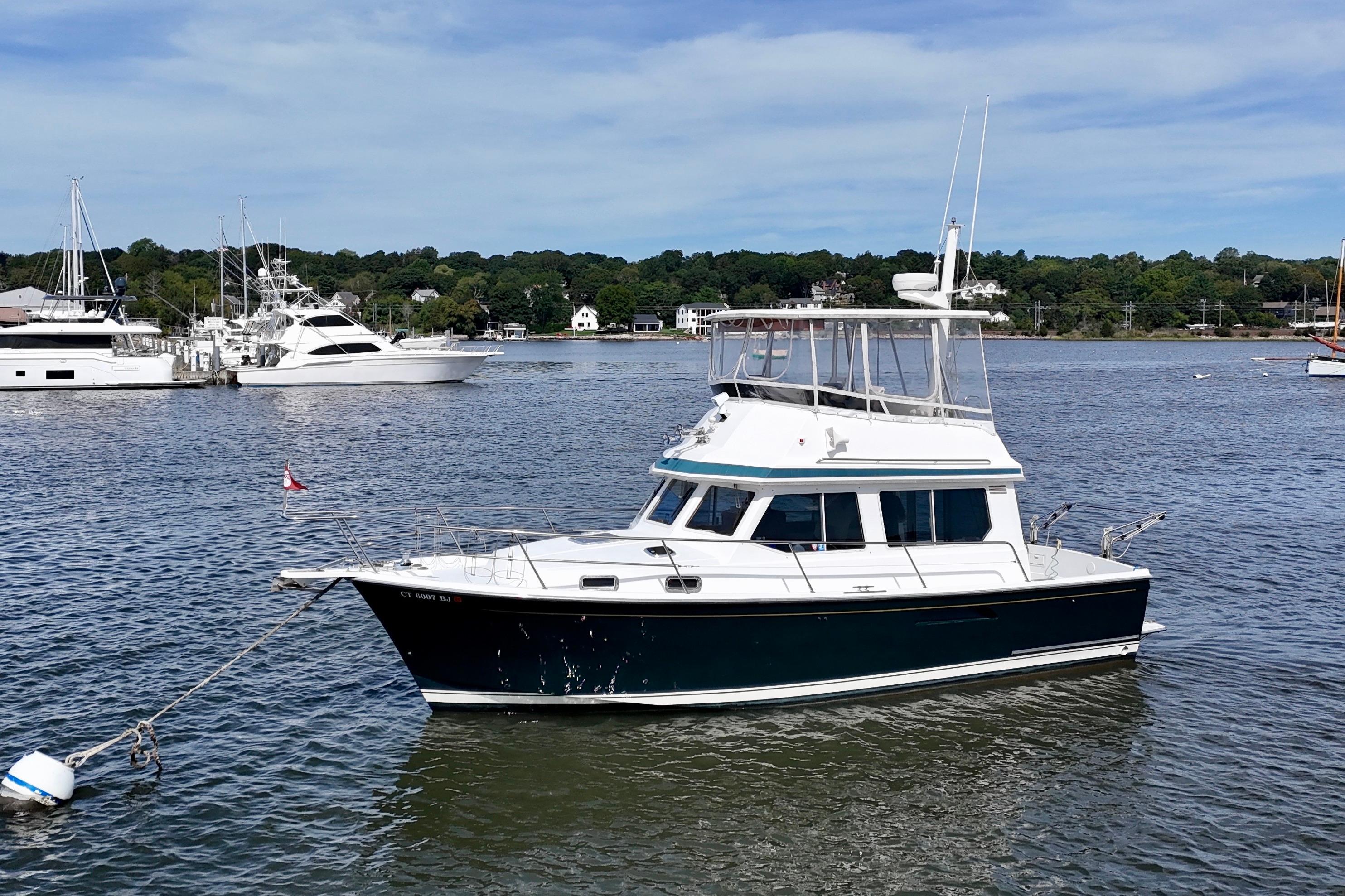 Sabre Sabreline 34 2001 Sabre Sabreline 34 yacht anchored in a scenic harbor setting.