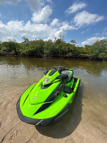 Yamaha WaveRunner VX Cruiser HO 2021 Yamaha WaveRunner VX Cruiser HO in vibrant green on a sandy shore.