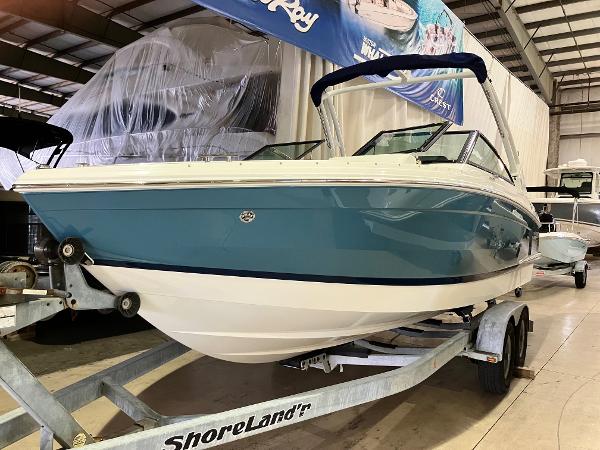 Cobalt R4 2024 Cobalt R4 boat on ShoreLand'r trailer in indoor storage.