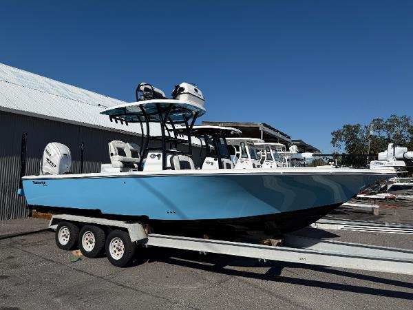 Tidewater 2700 Carolina Bay 2025 Tidewater 2700 Carolina Bay boat on trailer, blue hull, parked outdoors.