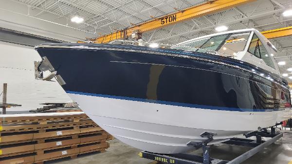 Formula 380 Super Sport Crossover I/O 2023 Formula 380 Super Sport Crossover I/O boat in a warehouse setting.