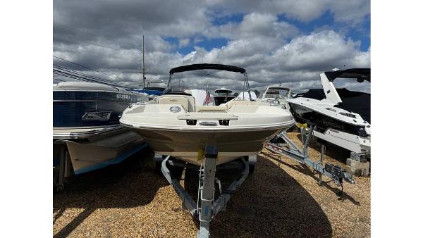 Stingray 192 SC 2022 Stingray 192 SC boat on trailer under cloudy sky.