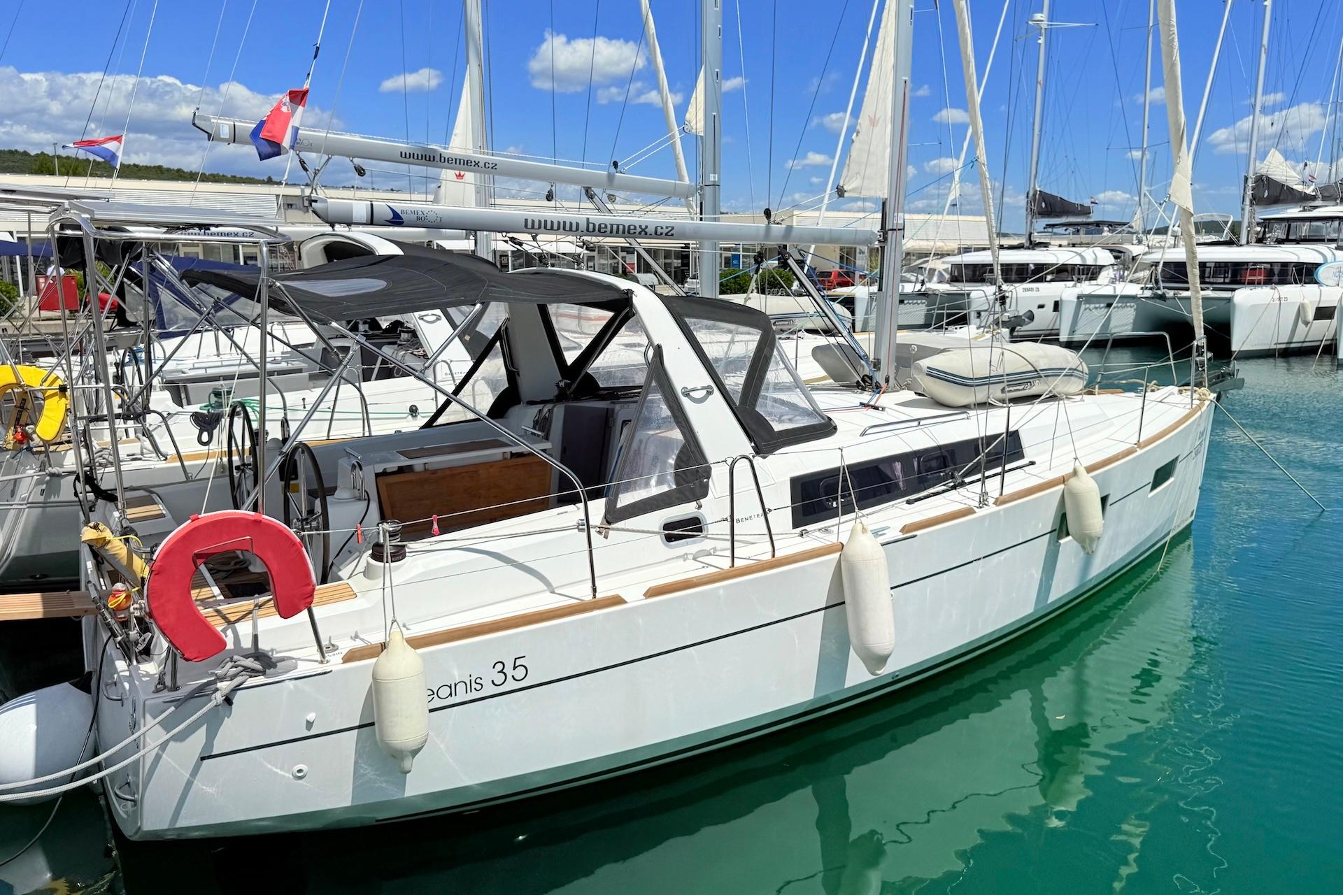 Beneteau Oceanis 35 2016 Beneteau Oceanis 35 sailboat docked in a marina, featuring sleek design and modern amenities.