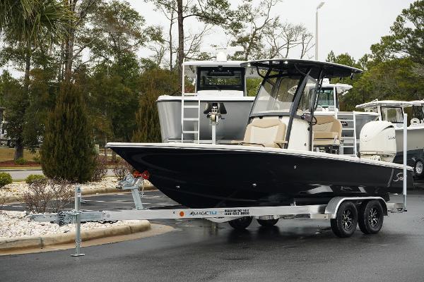 Scout 231 XSB 2025 Scout 231 XSB boat on trailer, parked outdoors.