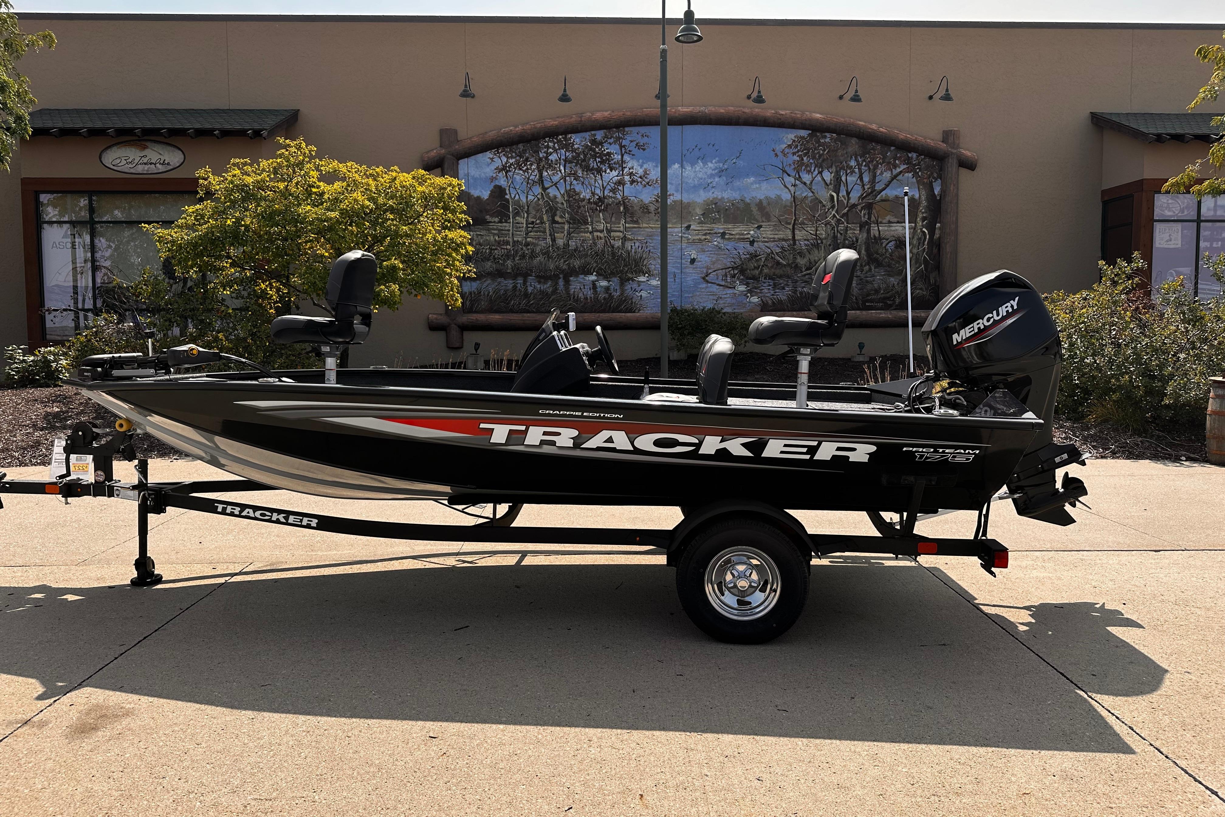 Tracker Pro Team 175 Crappie Edition 2026 Tracker Pro Team 175 Crappie Edition boat on trailer, parked outdoors.