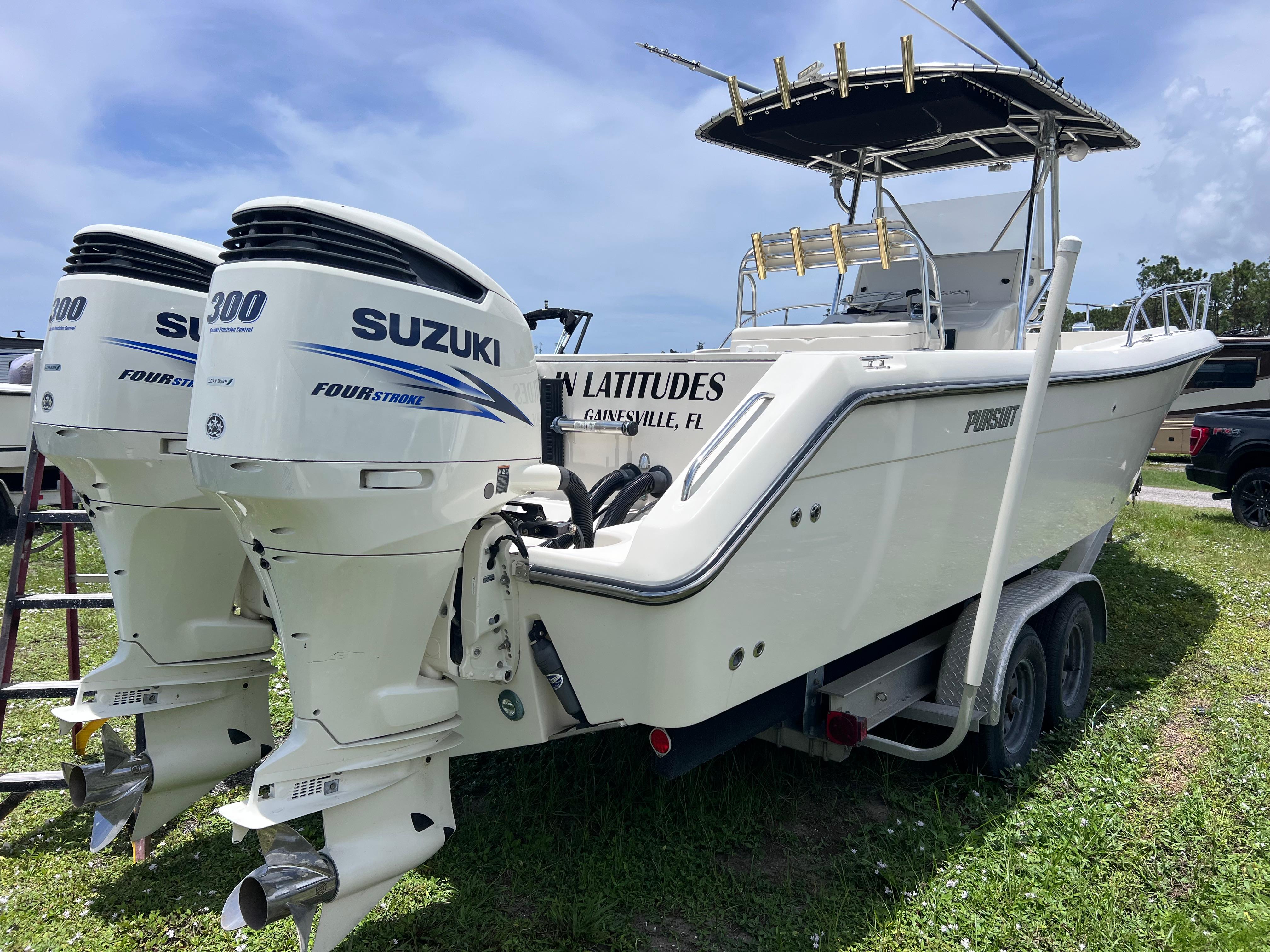 Pursuit 2870 Center Console 2003 Pursuit 2870 Center Console boat with twin Suzuki 300 outboard engines on trailer.