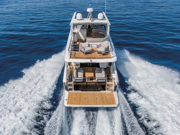 Absolute 53 Navetta 2025 Absolute 53 Navetta yacht cruising on open water, rear view.