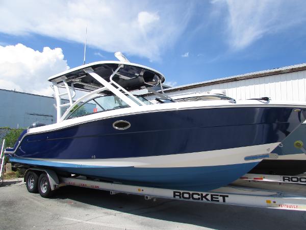 Robalo R317 Dual Console 2017 Robalo 317 boat on trailer under blue sky.