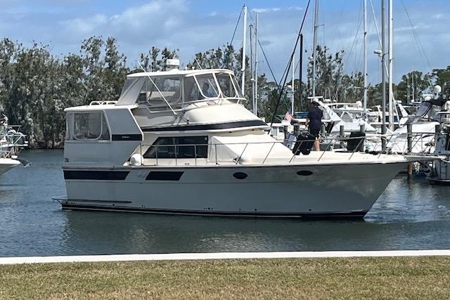 Californian 45 Motor Yacht 1987 Californian 45 Motor Yacht docked in a marina with clear skies.