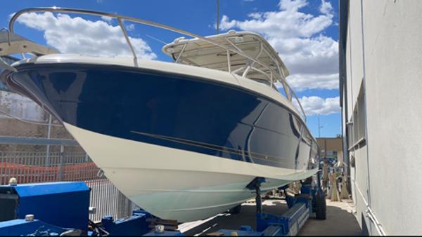 Vector 3300 VX Express 2006 Vector 3300 VX Express boat on trailer under a clear blue sky.