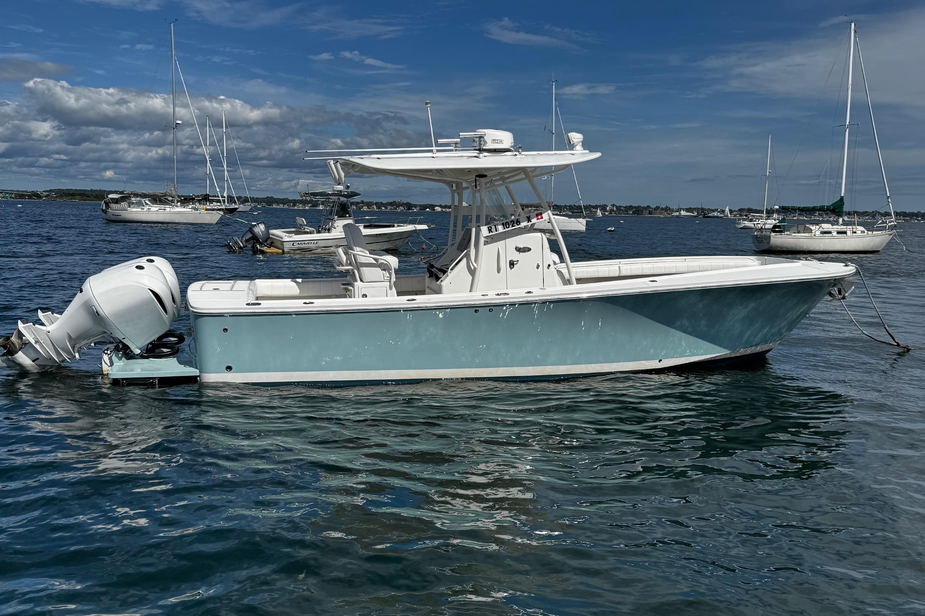 Regulator 28 Forward Seating 2015 Regulator 28 Forward Seating boat on calm water with sailboats in background.