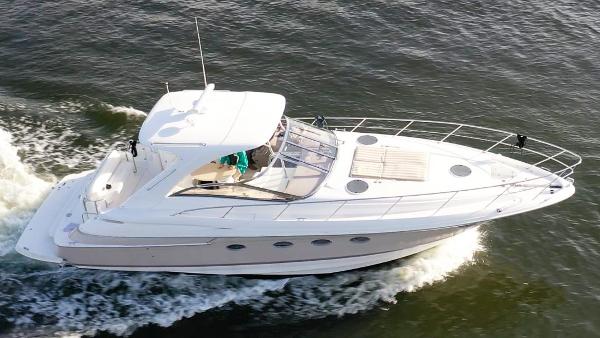 Regal Commodore 4260 2003 Regal Commodore 4260 yacht cruising on open water, aerial view.