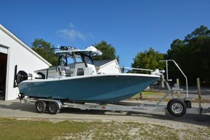 Costa Custom Boats 264HC 2024 Costa Custom Boats 264HC on trailer, parked outdoors under clear blue sky.
