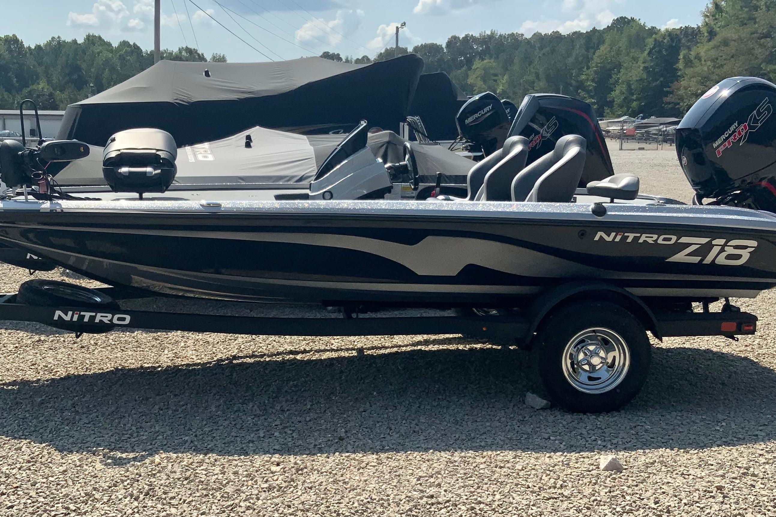 Nitro Z18 Pro 2026 Nitro Z18 Pro boat on trailer, parked outdoors under clear sky.