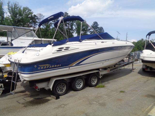 Chaparral 2830 Limited 1999 Chaparral 2830 Limited boat on trailer, blue and white design, parked outdoors.