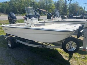Mako Pro Skiff 13 CC 2025 Mako SKIFF 13 CC boat on trailer, parked outdoors.