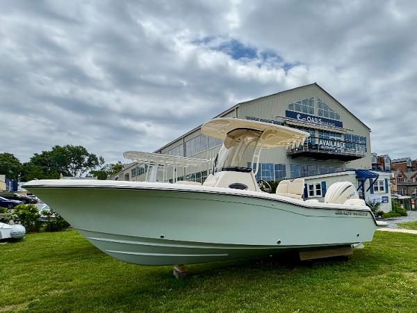 Grady-White Fisherman 216 2025 Grady-White Fisherman 216 boat displayed outdoors near a marina building.