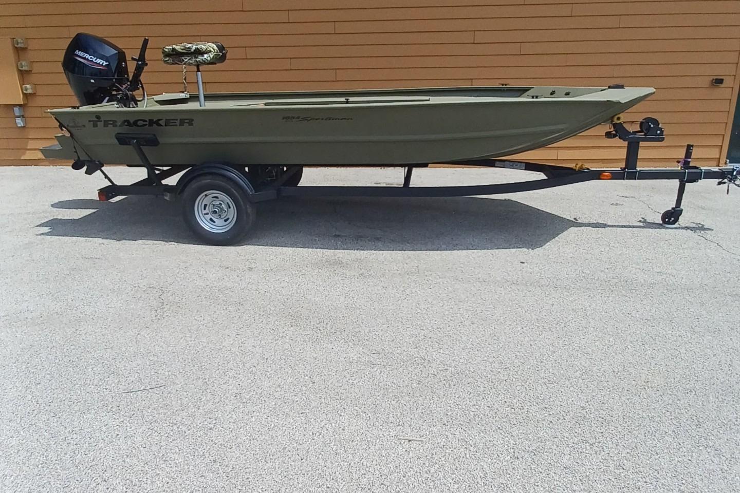 Tracker Grizzly 1654 T Sportsman 2026 Tracker Grizzly 1654 T Sportsman boat on trailer, side view.