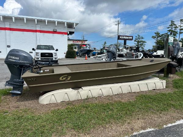 G3 1652 VBW 2023 G3 1652 VBW boat with Yamaha outboard motor on display at dealership.